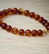 COLLAR BOLAS ÁMBAR MIEL