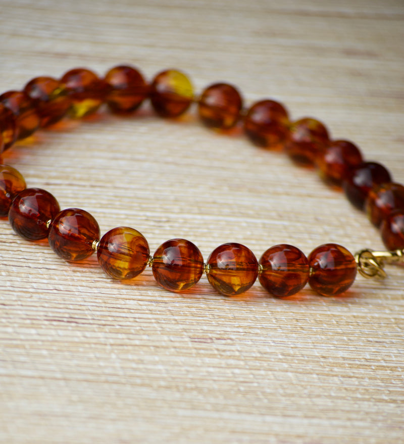 COLLAR BOLAS ÁMBAR MIEL